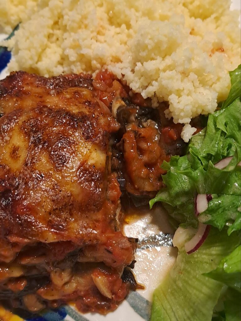 Classic parmigiana with couscous and salad