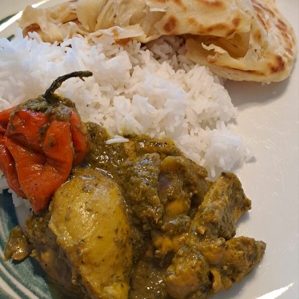 Trini curry chicken with rice and Buss Up Shut