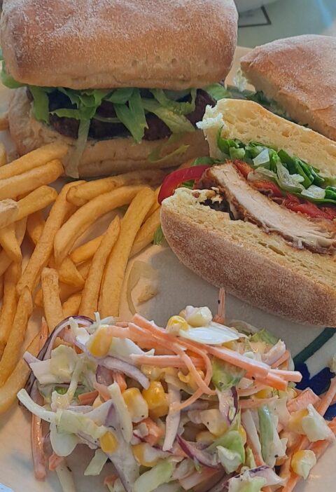 Spicy chicken burger, chips and coleslaw