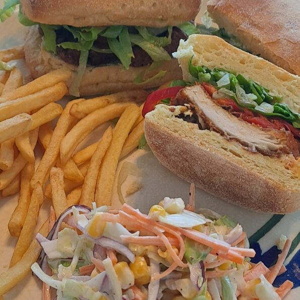 Spicy chicken burger, chips and coleslaw